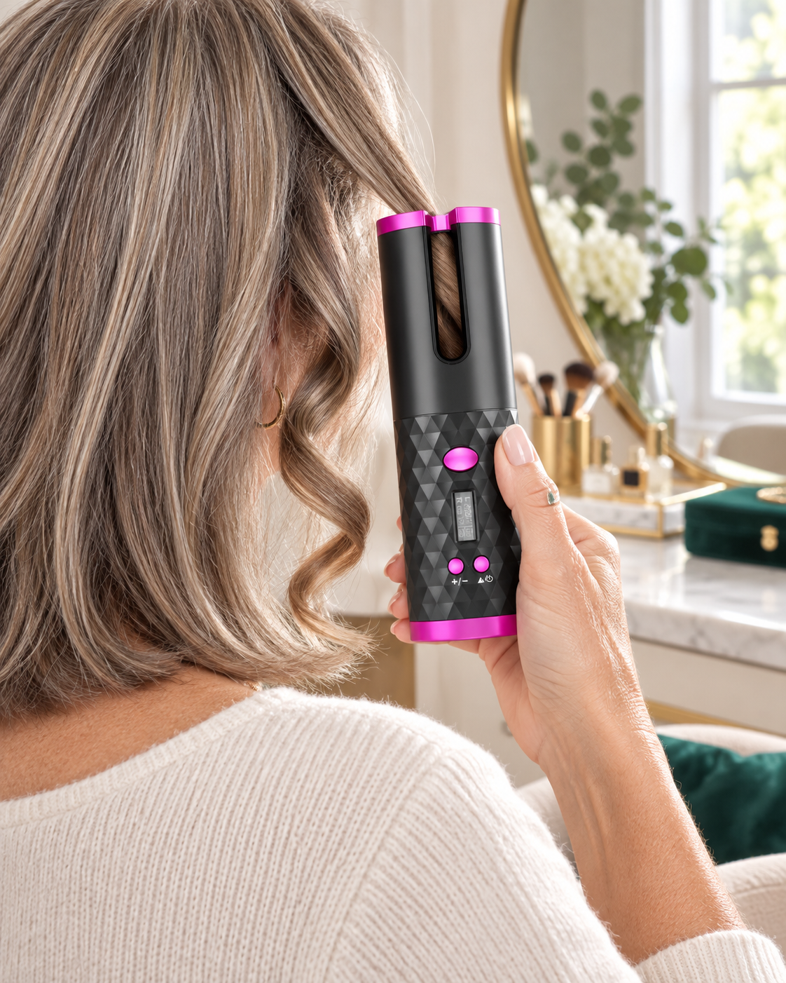 Woman using LumeCurl on a fine section of hair
